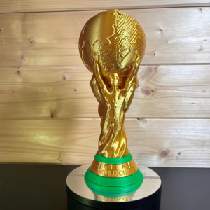 A picture of a replica 3d printed world cup trophy